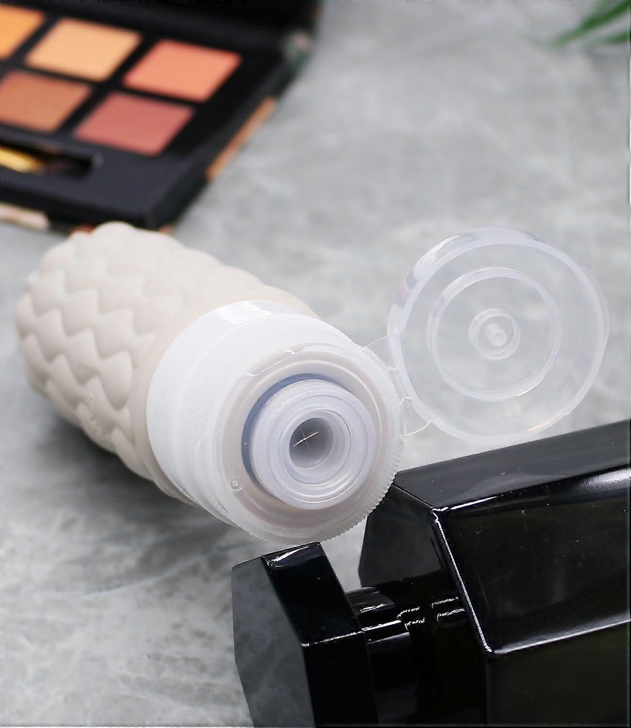 4 Pack Leakproof Silicone Travel Bottles Set with Toiletry Bag